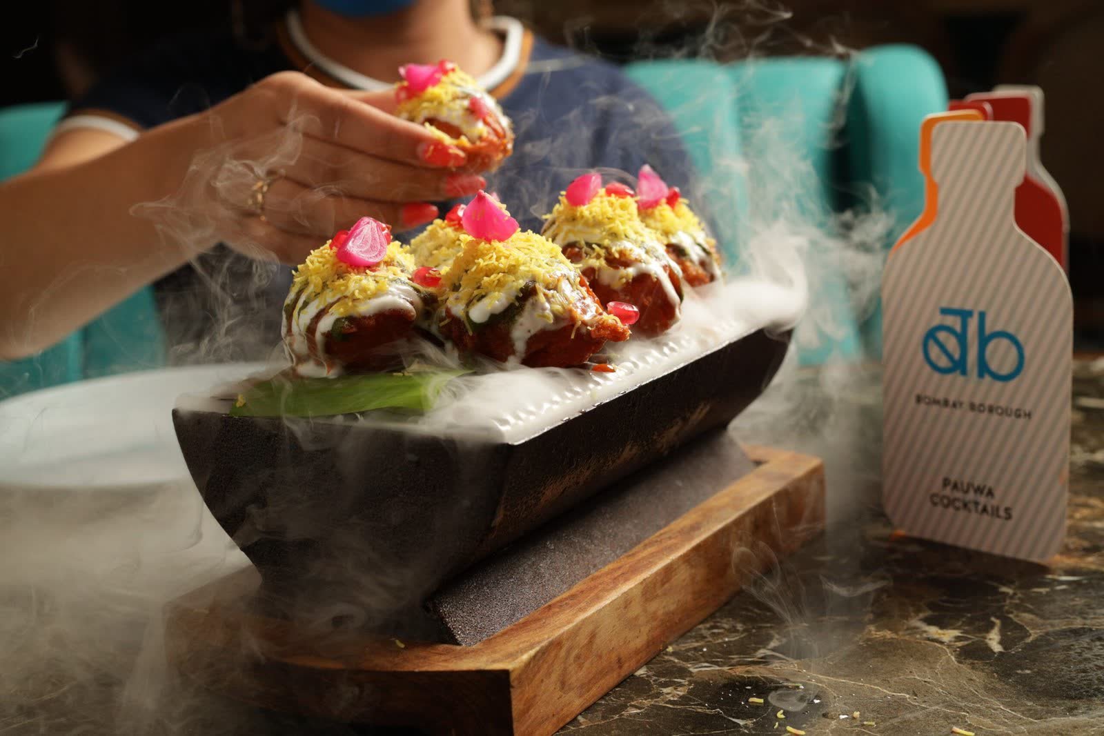 Smoking dahi puri chaat plated on slate at Bombay Borough, Dubai
