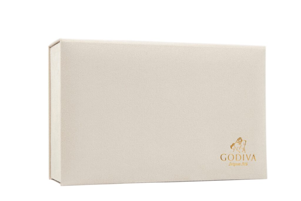 Closed white Godiva chocolate box with gold logo – minimalist luxury product image for e-commerce