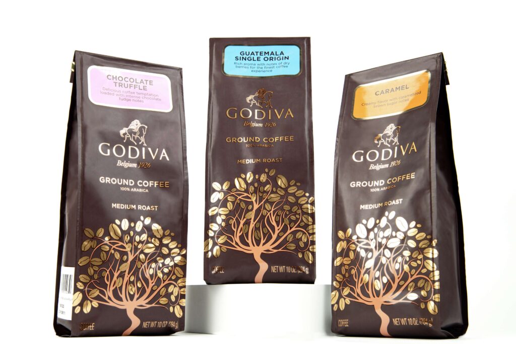 Godiva ground coffee collection in chocolate truffle, hazelnut crème, and caramel – premium e-commerce image by Food On Focus Media