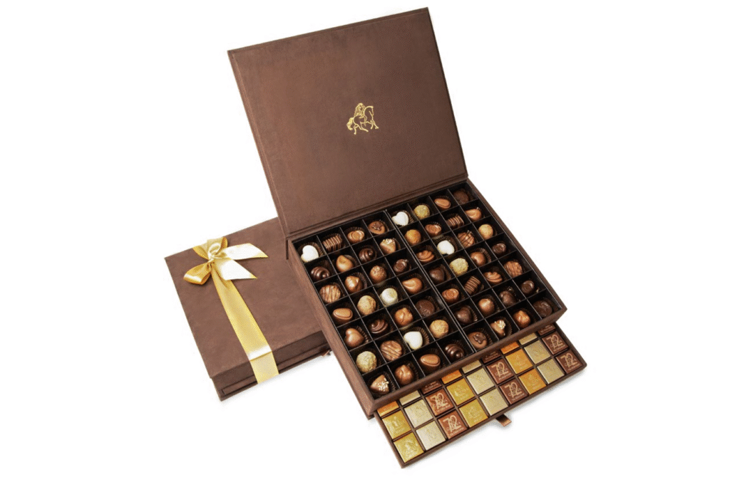 Luxury brown Godiva chocolate gift box with gold ribbon, assorted truffles and pralines – premium e-commerce photography by Food On Focus Media Dubai