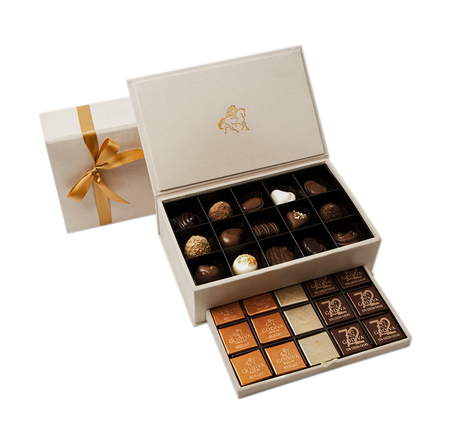Elegant white Godiva chocolate box with golden ribbon, showcasing assorted premium chocolates – photographed for online store by Food On Focus Media UAE