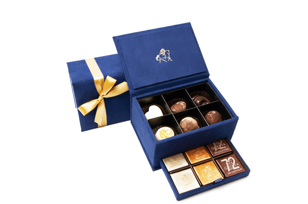 Blue Godiva chocolate box with gold ribbon, featuring assorted luxury truffles – premium e-commerce product photo by Food On Focus Media UAE