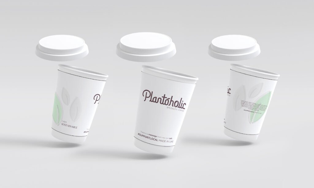 Plantoholic branded takeaway coffee cups photographed as a set on a plain background