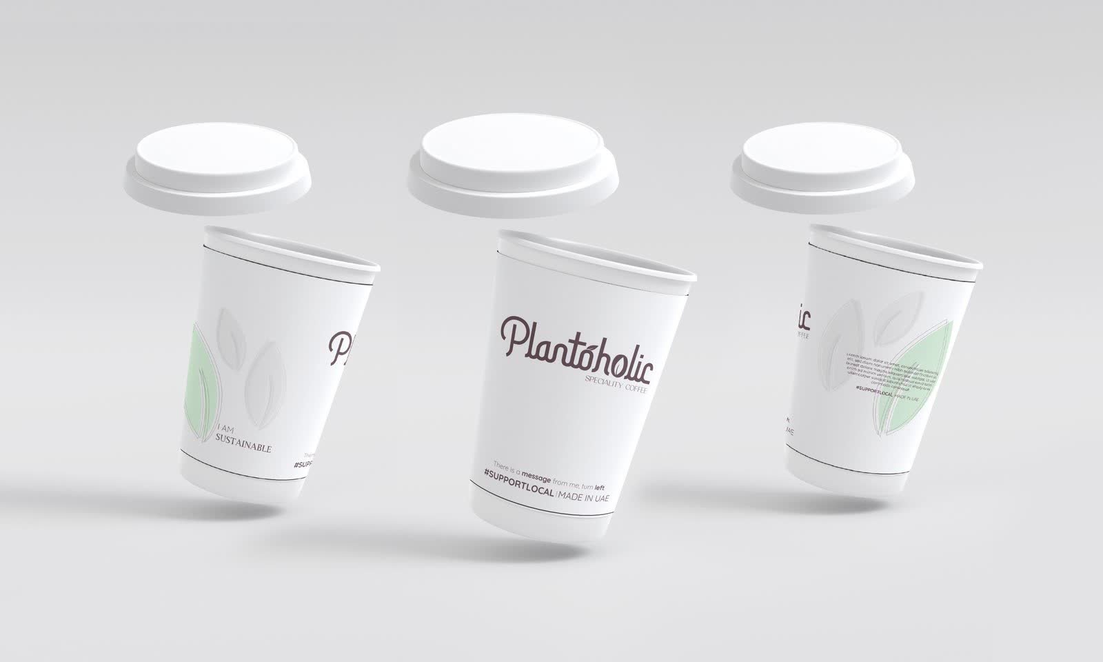 Three Plantoholic branded takeaway coffee cups with lids on a pale grey background
