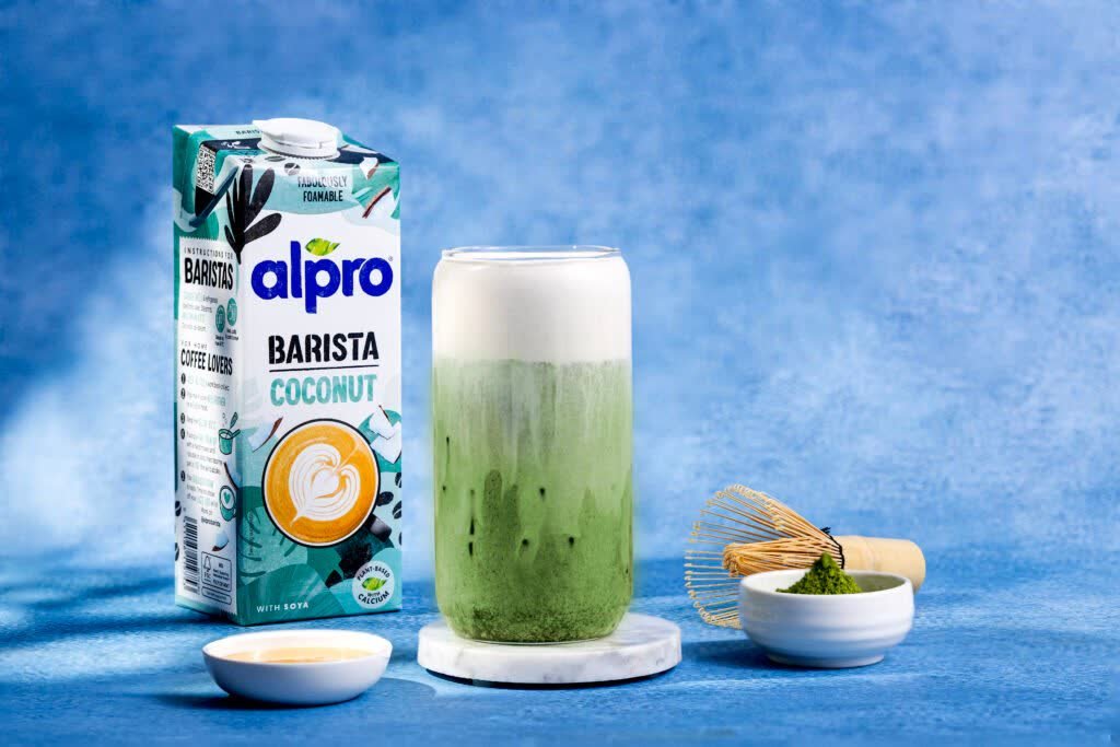 Alpro Barista coconut carton beside a matcha latte, from our Alpro summer campaign