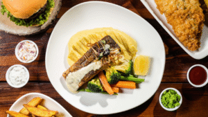 Restaurant-style pan-seared fish with mashed potatoes and vegetables in Dubai