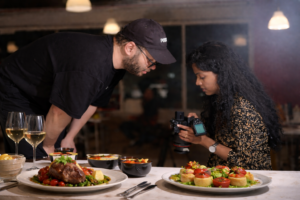 Culinary photographers reviewing gourmet creations