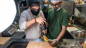 A food videographer captures food being prepared